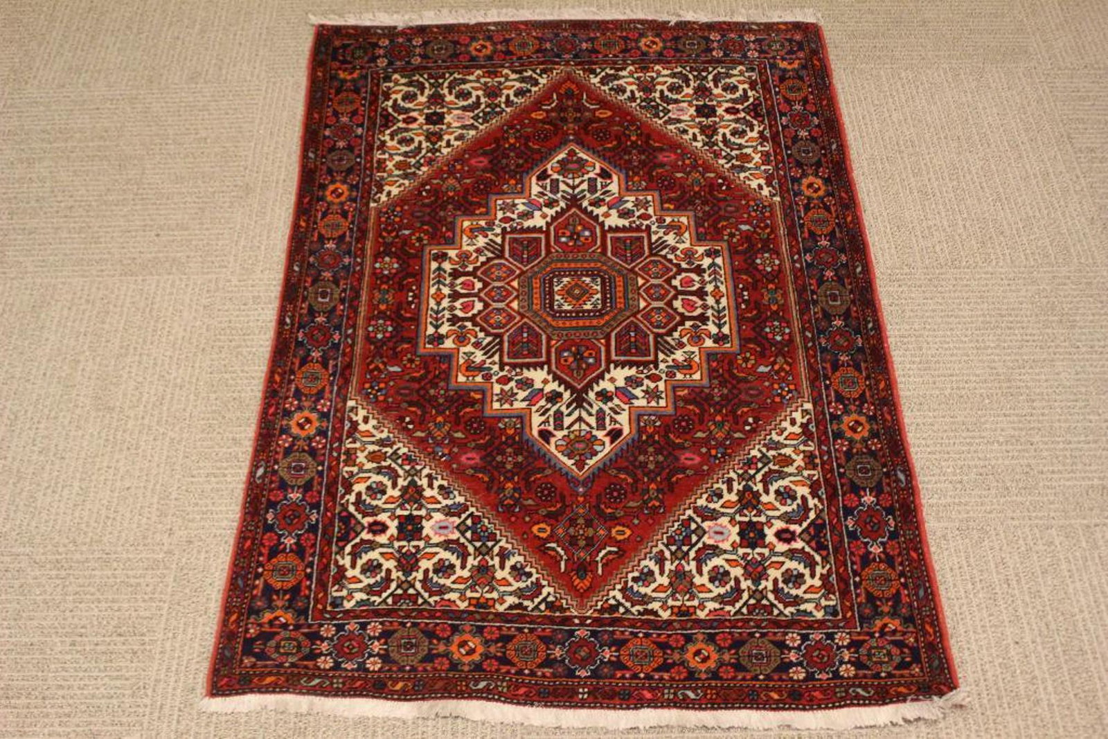 Semi Antique Persian Carpet: Measuring approx. 57" fringe to fringe by 38" very good condition with birds placed in center medallion, see photos.