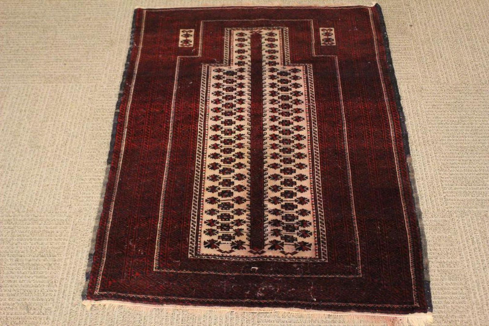 Baluch Persian Pray Rug: Tight woven semi antique pray rug approx. 48" by 34". Showing light signs of wear and bleeding.