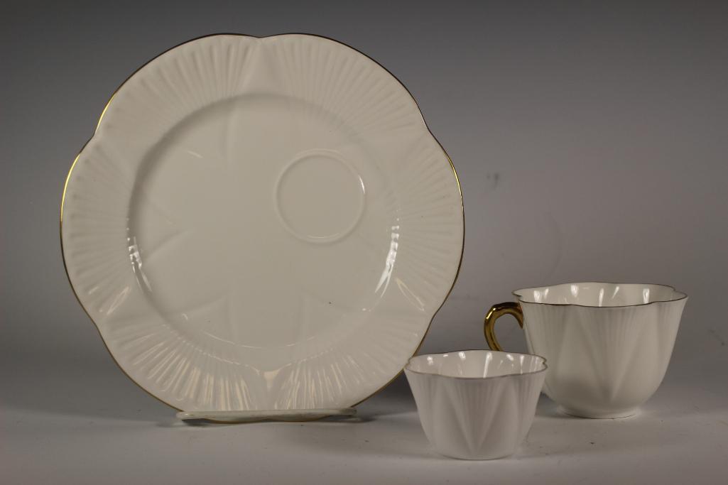 Three Piece Shelley Bone China Regency: Shelley Bone China "Regency" pattern all white with gold trim. Includes 1 tea cup, 1 snack tray saucer and 1 dainty sugar bowl. All in good condition with very light to no signs of use, see photos.