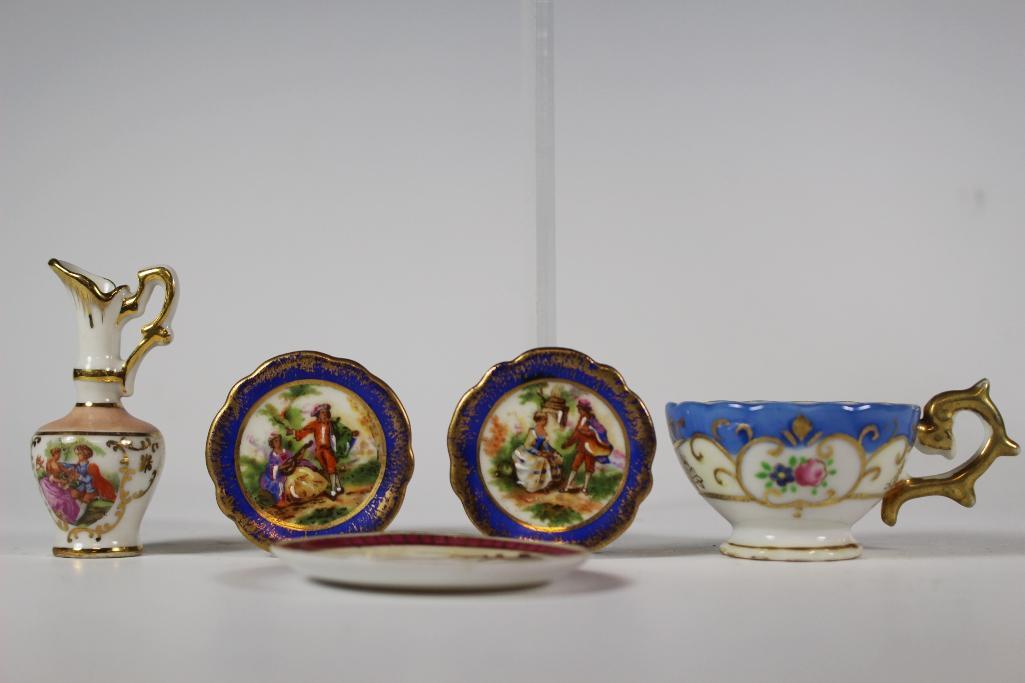 Collection of Seven Miniature Limoges Japan: Collection of Limoges and Japan miniatures plates 1 3/4" to 2 3/4", tea cup 1 1/4", ewer 2 1/2". All in good age appropriate condition, see photos.