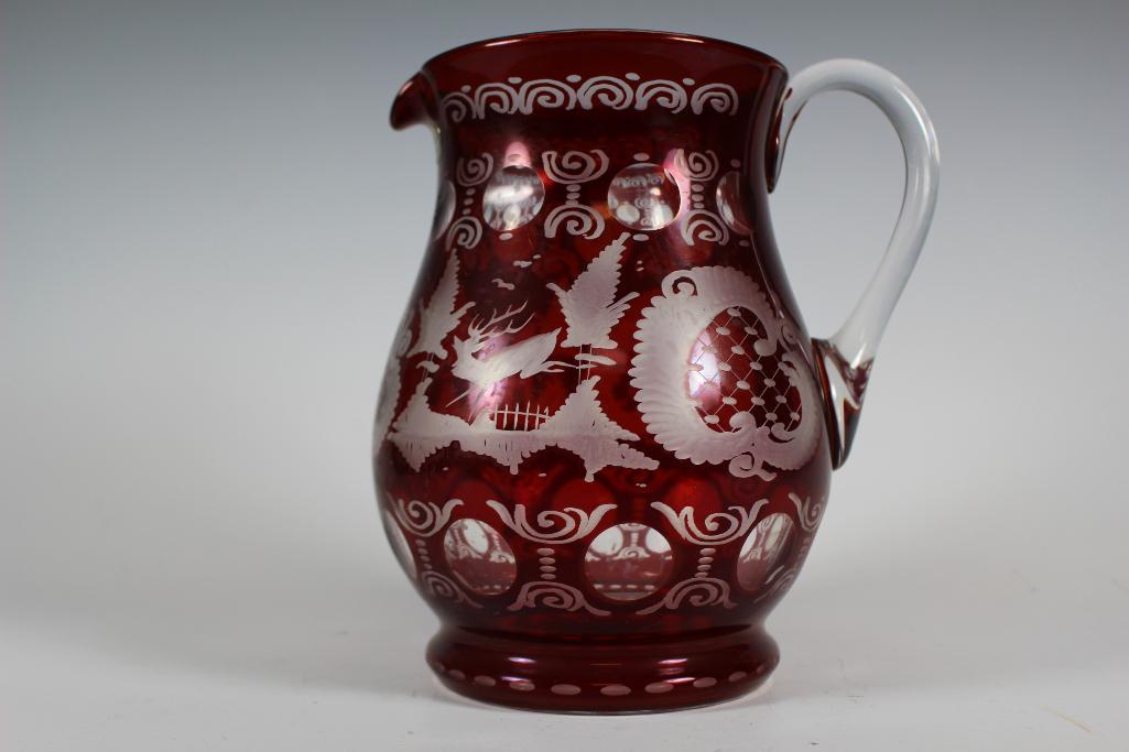CZECH BOHEMIAN Ruby Cut to Clear Drink Pitcher: With applied clear handle and stag cut etched pattern. Measuring approx 8" tall. Condition is good, see photos.