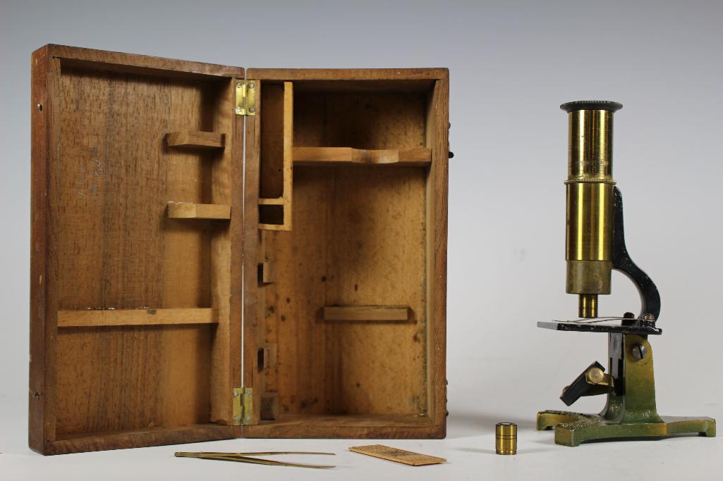 1890's James W. Queen Brass Microscope: Late 19th century James W. Queen & Co. Philadelphia Universal Household Brass Microscope with original wood box, slide, lens and tweezers. Approx. 7 1/4" tall.