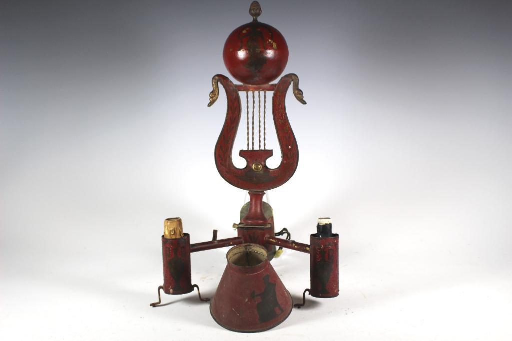 Antique Lyre Base Wall Electric Sconce: Tole painted with lyre center having brass swan heads on either sides. Red painted with black figural women atop and on the one shade. Approx. 17 1/2" tall in age appropriate condition with some paint