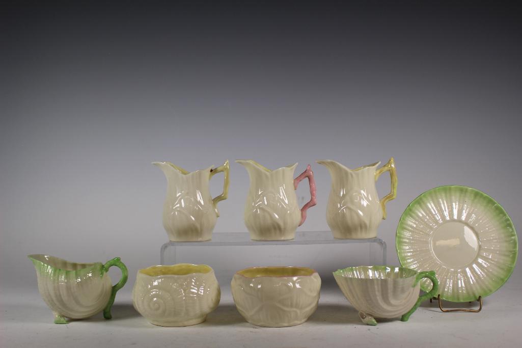 Collection of Early BELLEEK Porcelains: Group of various early BELLEEK Irish porcelains including black marked cup and saucer with shell designs (has dead sound with flicked internal crack not visisble), black marked cram and sugar with pin