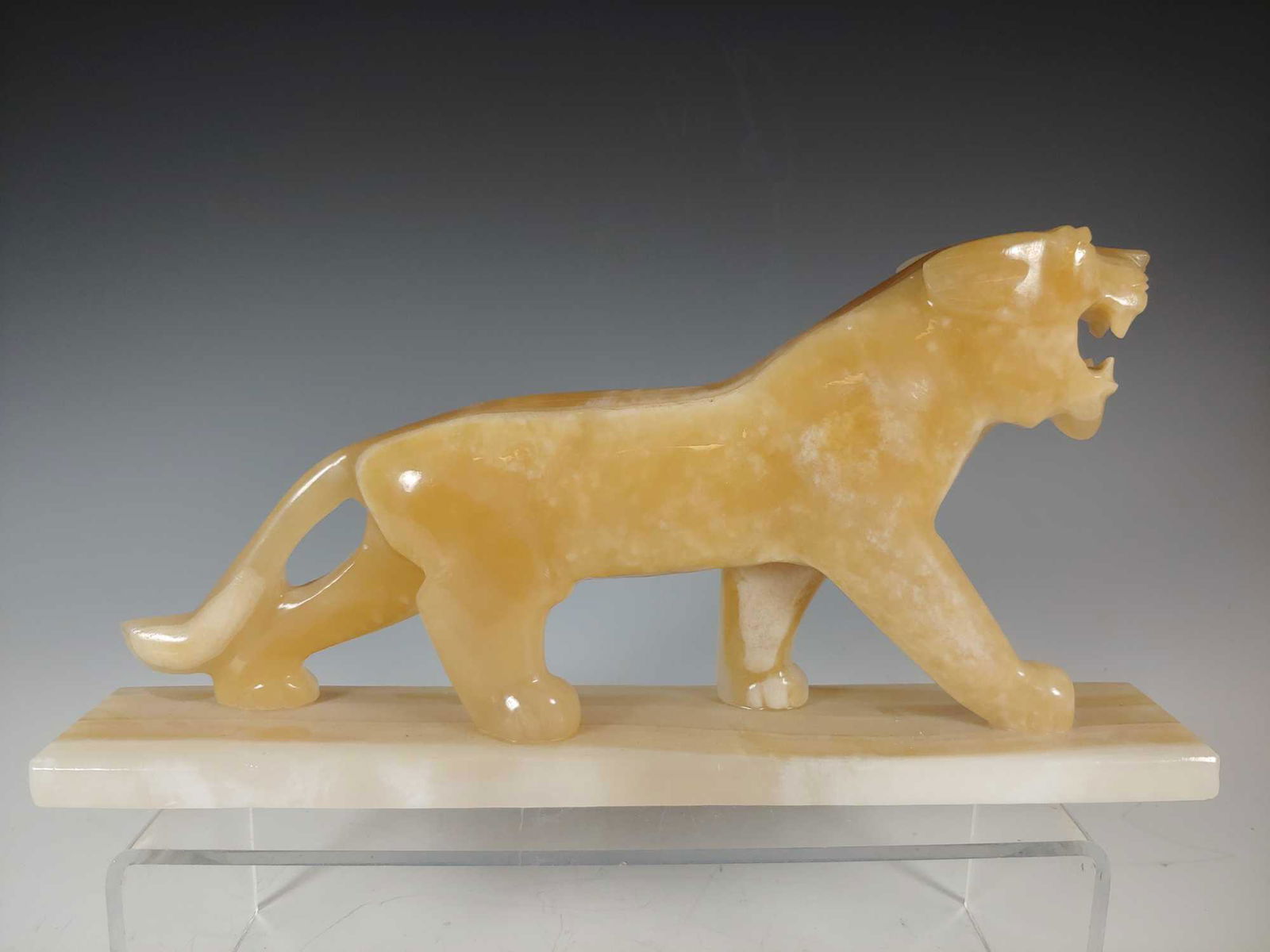 Alabaster Big Cat Statue: Alabaster lion or panther tan and white statue. Approx. 12 1/2" long by 6" tall. In good condition, see photos.
