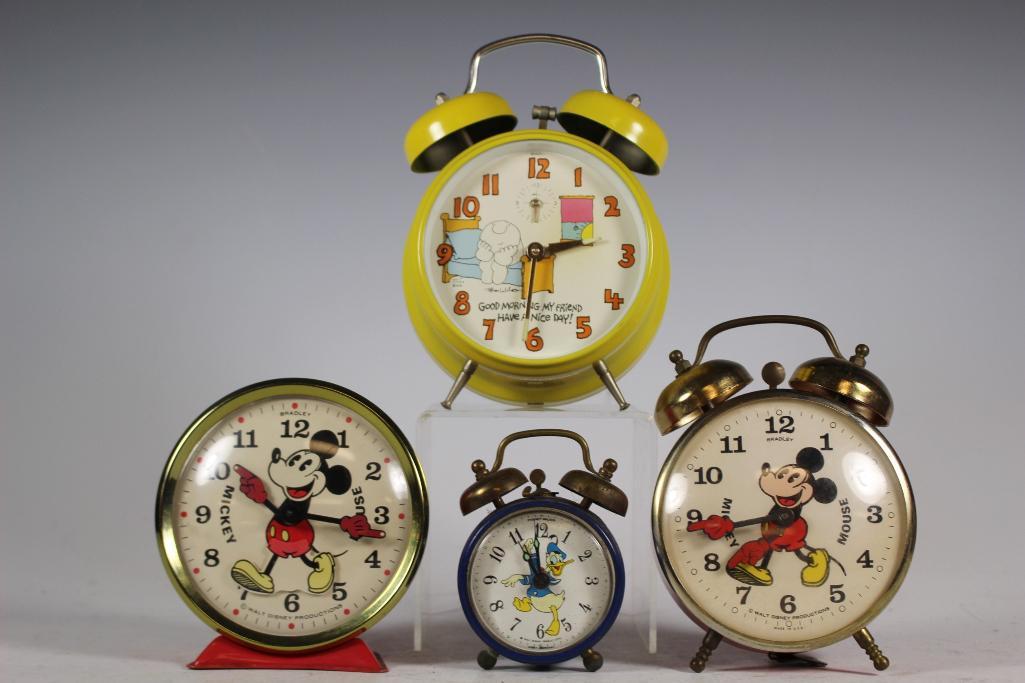 4 Vintage Alarm Clocks Mickey Mouse Donald and Ziggy: Includes; 2 Mickey Mouse Walt Disney production 4 1/2" alarm clocks by Bradley, yellow Ziggy 5 1/2" alarm clock very clean and Phinney-Walker Donald Duck 4" alarm clock showing signs of age, see photo