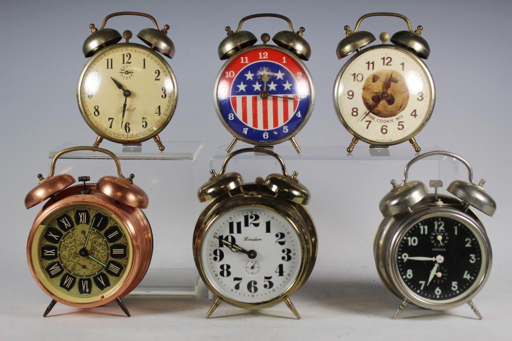Collection of 6 Vintage Alarm Clocks: Group includes; Kaiser copper clock, Lafayette Nestle Cookie Mix clock, Robertshaw brass clock, American red white and blue clock, Kienze silver clock and Linden brass clock. All in vintage used condi