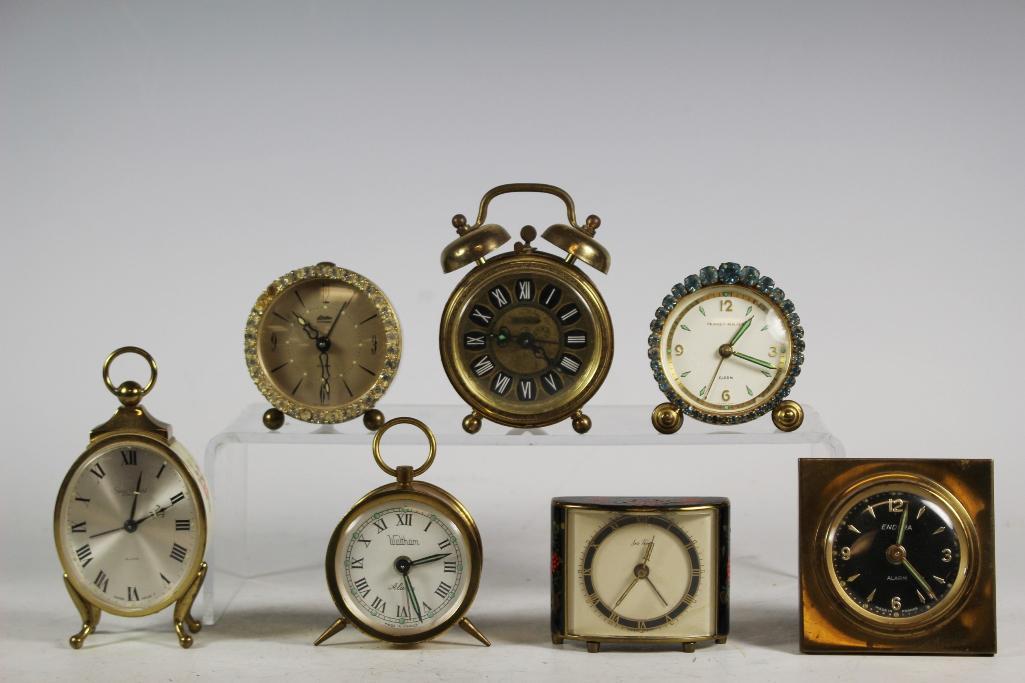 7 Vintage Miniature Alarm Clocks: Includes; Endura brass tone clock, Linden Black Forest, Waltham brass clock, Blessing, Seth Thomas, Swiza Sheffield and Phinney-Walker. Approx. 2 1/4" to 4 1/4' tall in vintage used condition with sig