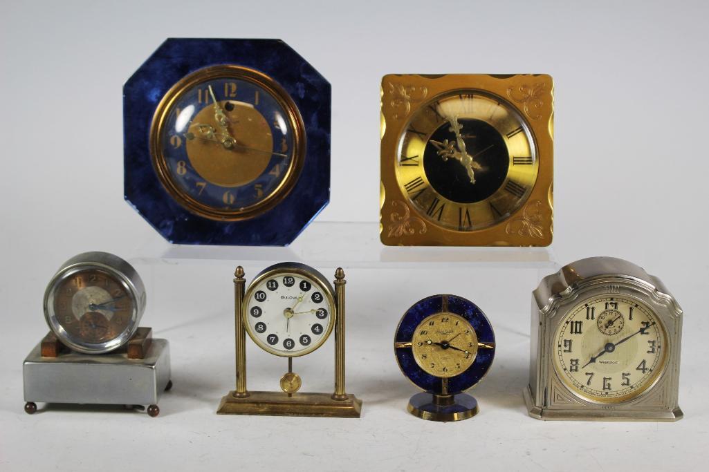 Collection Vintage Alarm Clocks: Group includes; Swiza Sheffield brass clock, Westclox silver clock, Bulova column clock, Telechron blue mirror clock , Seth Thomas brass clock and imperial silver tone clock. Approx. 2 3/4' to 4 3/4"