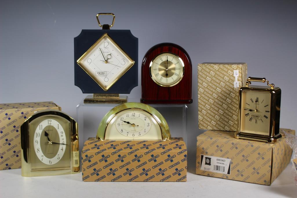 Collection of 6 Seiko Desk Clocks: Collection of 6 Seiko electric powered desk clocks, small mantle clocks all new in box. Great holiday idea, see photos for details.