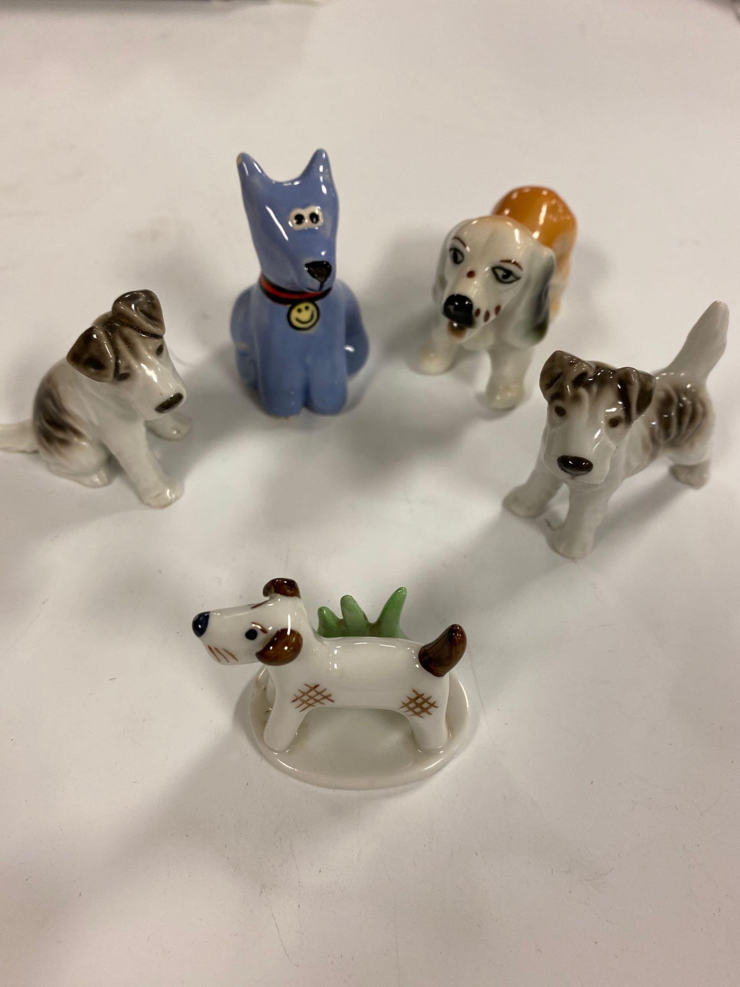 Collectibles Collection Lot: Collection lot includes porcelain dogs, basket made out of a walnut shell, I Love My Dog charm keychain, sterling and gemstone necklace, cat yawning figure and more.