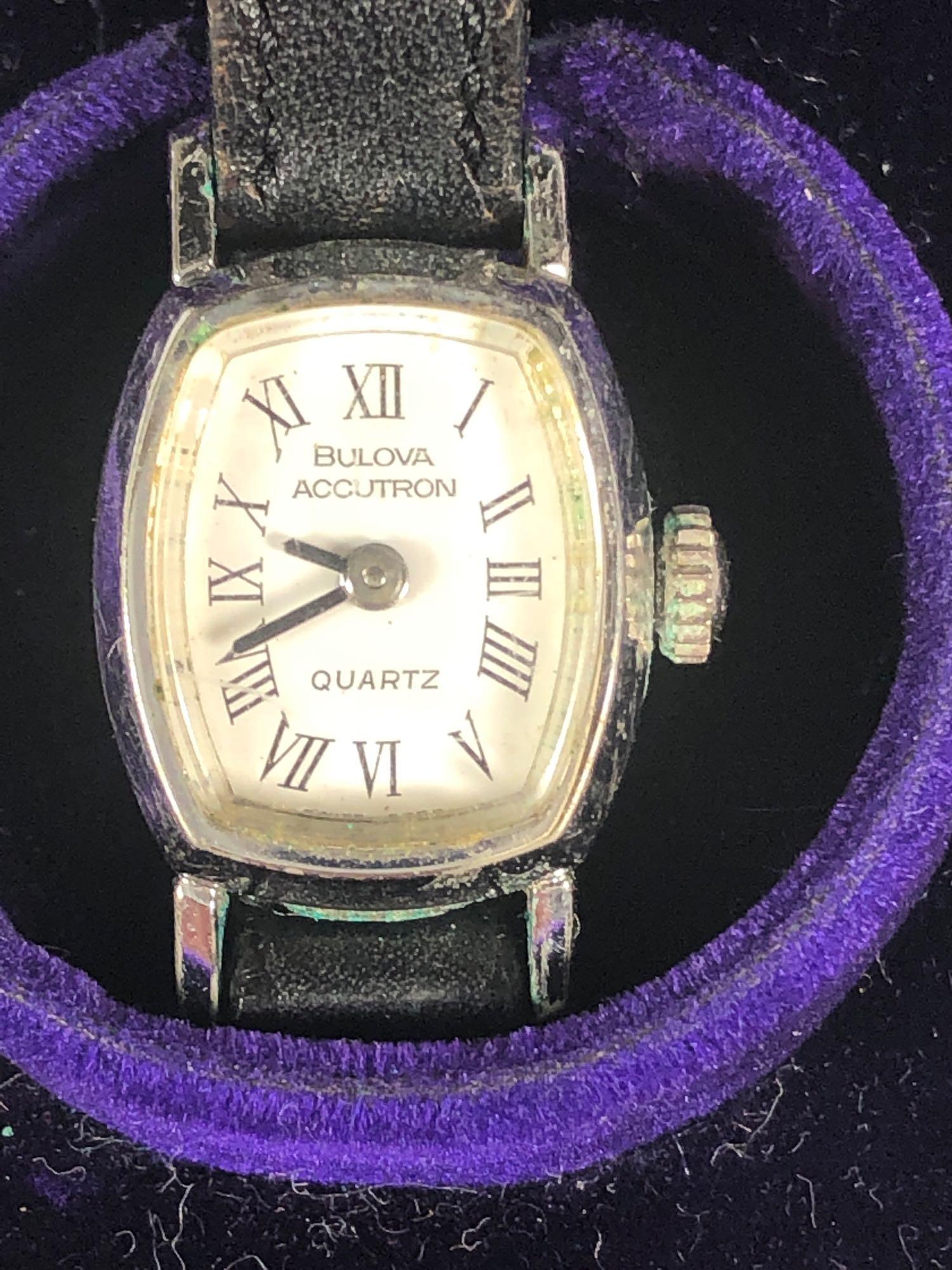 Vintage Ladies Bulova Accutron Wrist Watch: Vintage ladies BULOVA ACCUTRON wrist watch with lather band and contained in original wood box with purlple lining. Not working. See photos