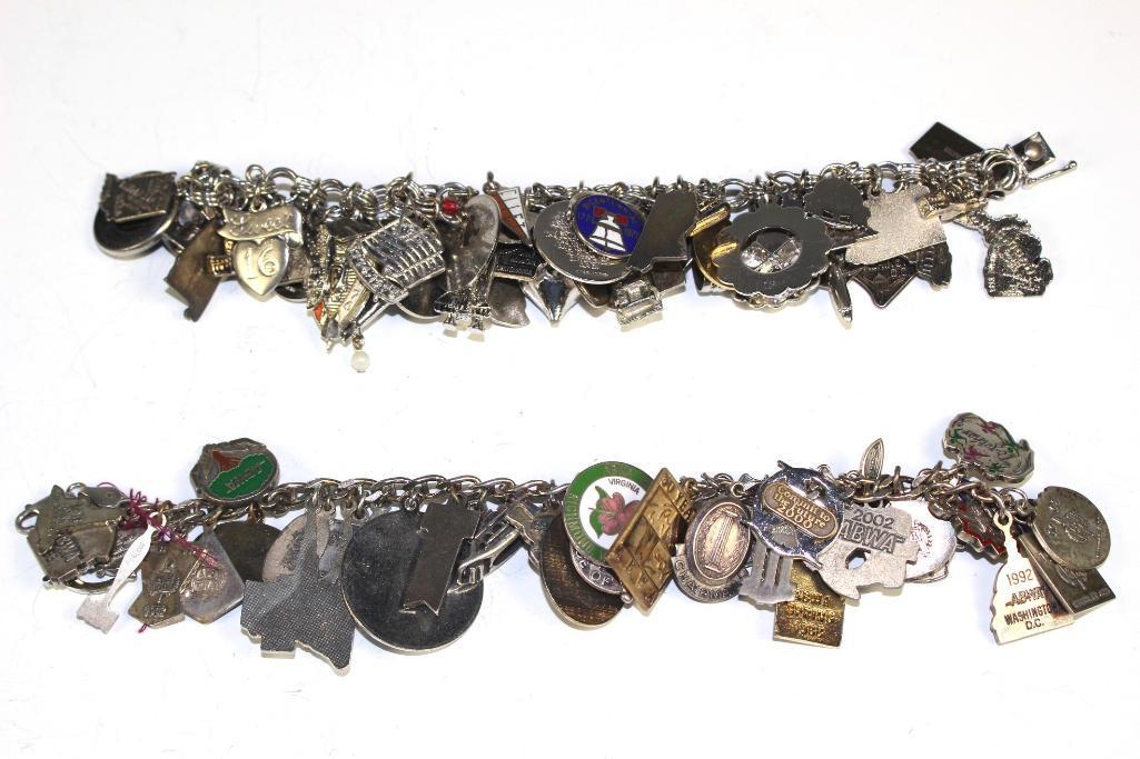 2 Large Sterling Silver and Metals Charm Bracelets: 2 heavily filled charm bracelet with multiple kinds of charms from states, trinkets, Disney and many others. Mixture of sterling silver charms and bracelet with other metals. Approx. 7 1/2" to 8" long
