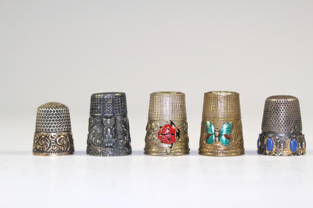 5 Vintage Thimbles: Group of 5 metal thimble made in Germany, Italy and Portugal including one sterling silver. One having painted ladybug one having painted butterfly one with blue lapis and one with embossed owl. All i