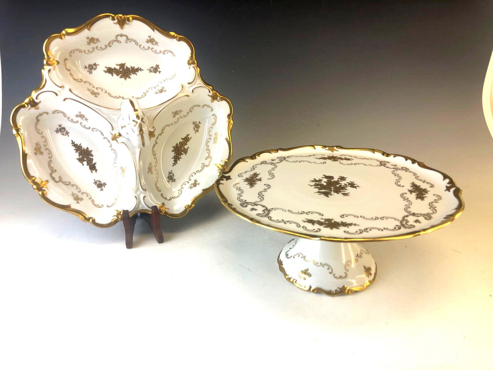 Vintage Reichenbach Fine Porcelain Lot Pedestal Cake: Vintage Reichenbach Fine Porcelain Lot Pedestal Cake Dish and Tid Bit Tray Signed R Made In GDR. good overall condition with no chips or cracks. light wear to gold trim. Cake stand measures approximat