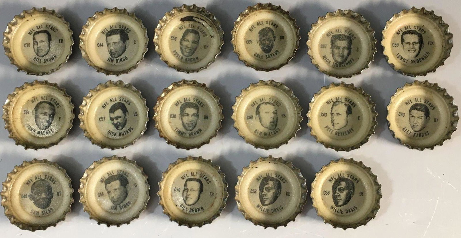 1960's NFL TAB Bottle Caps (17) w/ Gale Sayers: Bottle caps off of Tab bottles. Karras, Ringo(2), Willie Davis(2), Mackey, Retzlaff, Butkus, Tommy McDonald and others.