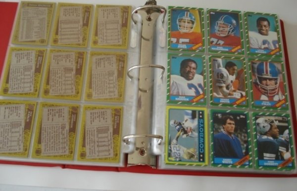 1986 Topps Football Card Complete Set: Complete set in an album that grades out as EXMT-NRMT. Important rookie card of Jerry Rice is a beauty!