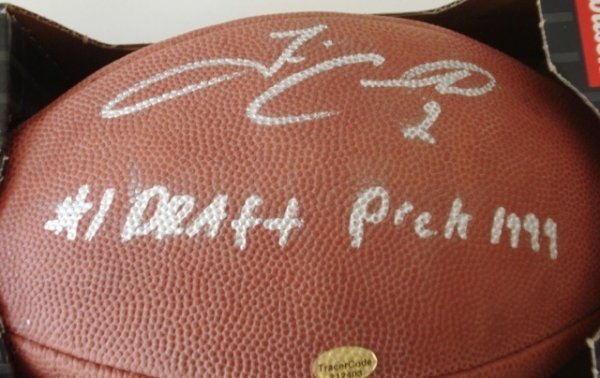 Tim Couch & Ricky Williams Autographed Football: Official Wilson NFL game day football signed by each former college stars and high draft picks. Each has added his own inscription. Tracercode COA card and hologram.