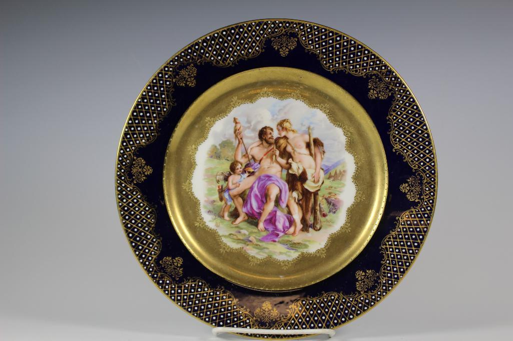 19th Century Italian Renaissance Painted Plate: Fine Meissen quality cobalt, gold gilt and white bead enameled plate. Having a Italian Renaissance stylized painting. Topless women wearing a fur pelt standing over a seated nude man. Great presentati