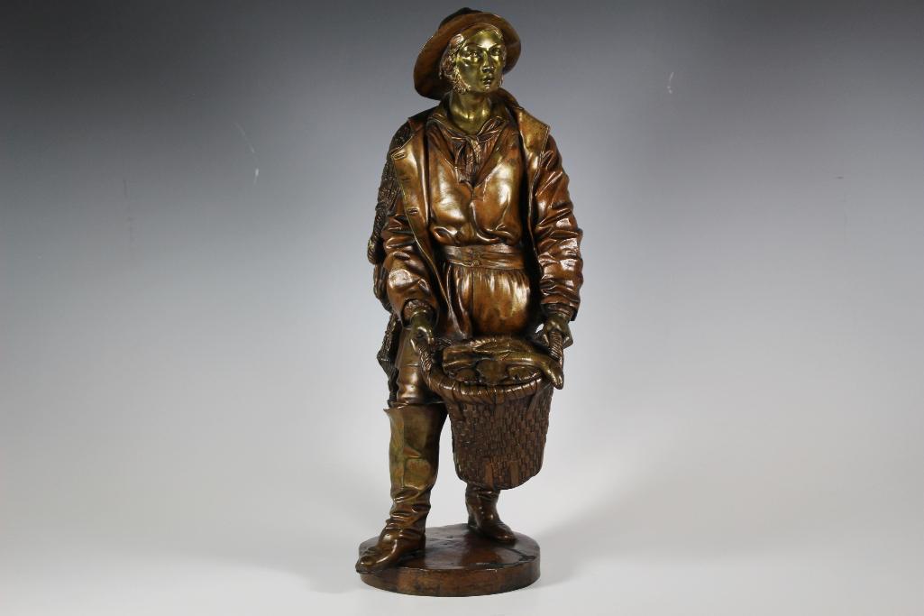 Fine French Bronze of Young Male Fisherman: Heavy detailed bronze of young man holding a basket full of fish. Fisherman bronze standing approx 19" tall. Signed on base rim verso "L & F Mozeau" as shown. Similar in style to lot 60. See photo
