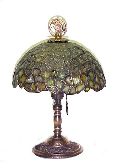 Chicago Mosaic Jeweled Shade: mounted on a bronze base with floral and open pierce work. Pelican bird finial. Marked Segar Studious NY. on base. The quality and style of Segar Studios is very similar to Oscar Bach Studious NY. Con
