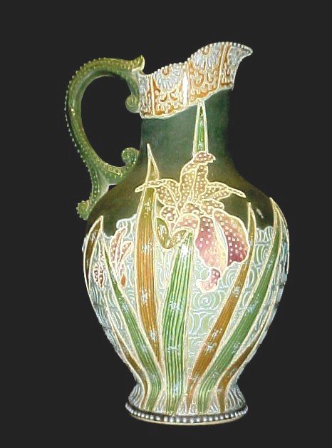 Impressive Dai Nippon Moriage Pitcher Meiji Period: Ca. 1862--1912.Dai Nippon Taizan Sei Japanese region pitcher with heavy piles of enamel slips. And generous amount of beading work throughout the decoration of foliage design, over a dark green satin 