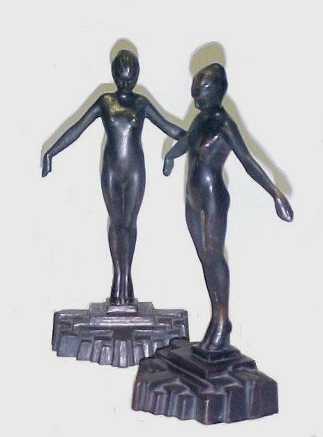 Frankart Art Deco Nude Bronze Bookends: featuring a nude lady with arms raised to her sides, while standing on a geometric altered base of blocks. 9'' h. X 5 1/4'' w. wt. 11 lbs