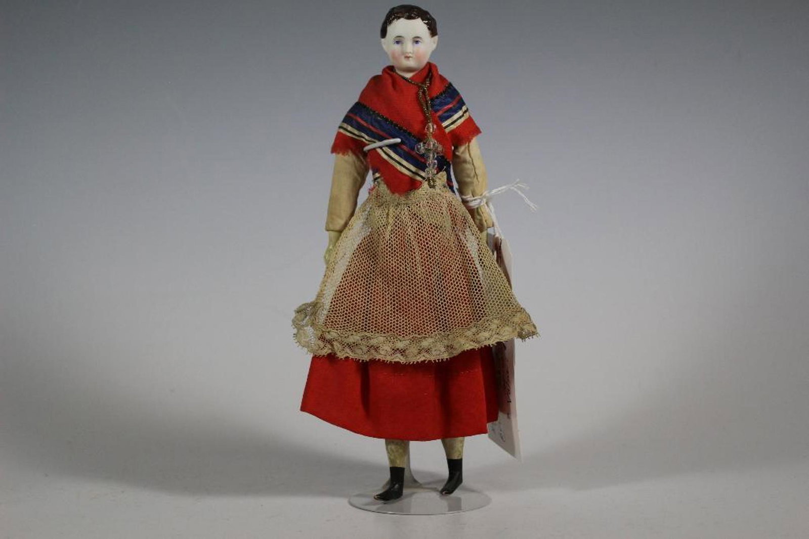 10.5" Brown Short Hair Parian Cloth Body Wood Limbs: 10.5" Brown Short Hair Parian Cloth Body Wood Limbs Circa 1840-1850 with boyish style. Brown short hair similar to a boys hairstyle with brush strokes around parts of the forehead with exposed ears. O