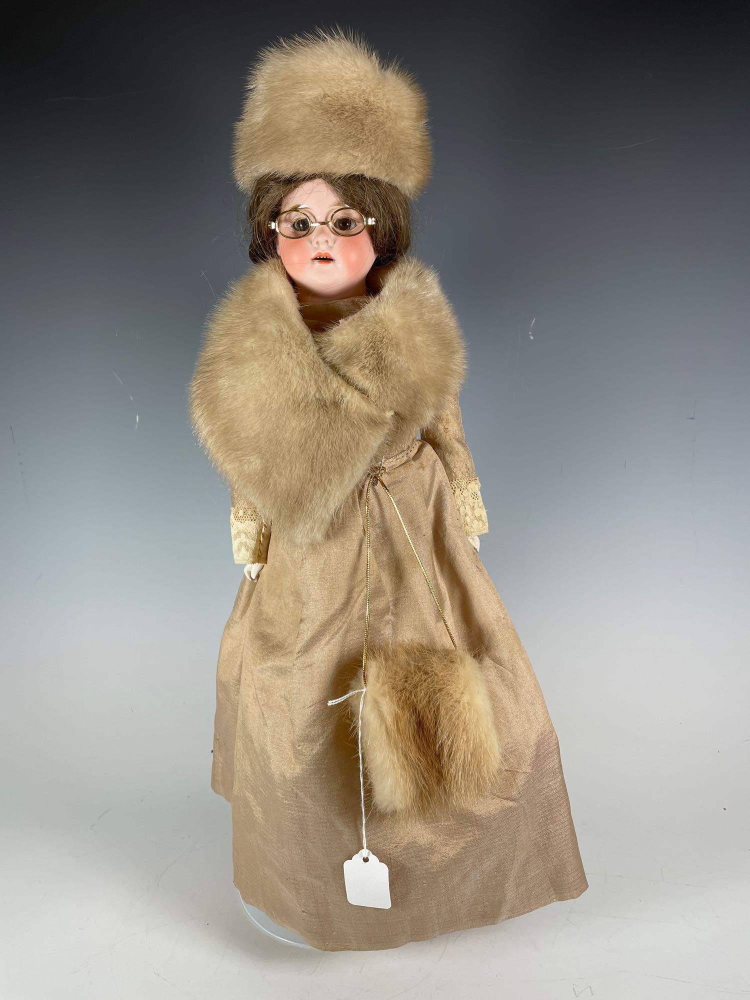 1894 Armand Marseille German Bisque Shoulder Head: Doll placed on kid leather body, some repairs and restoration. Poor/fair condition. Note flaws on left fingers. Human hair wig, turned head wearing later handmade mink clothing as shown. She displays