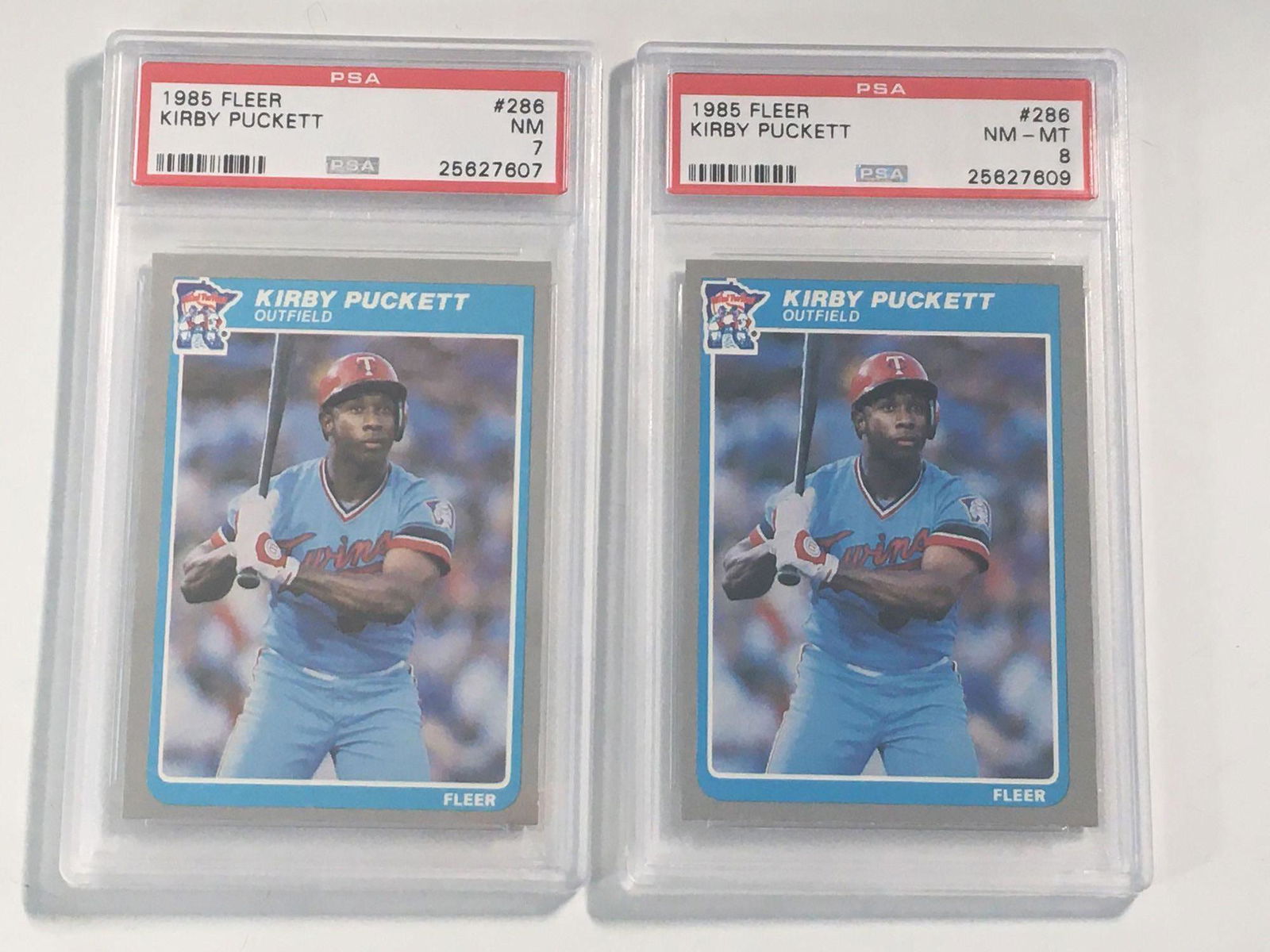 (2) 1985 Fleer #286 Kirby Puckett PSA Graded Cards: Two PSA graded Puckett Fleer first regular issue rookie cards; one is NM-MT 8 and one is NM 7.