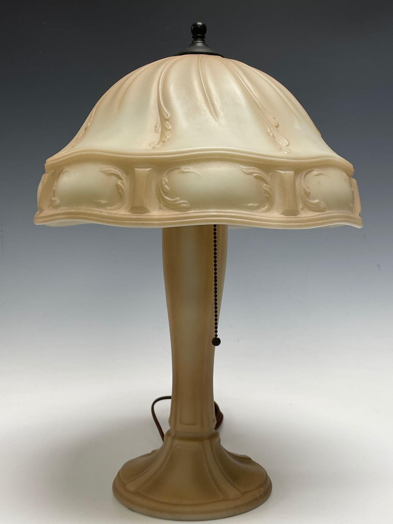 Antique Beige and Cream French Influenced Art Glass: 20th century frosted tan table lamp with French Renaissance influenced throughout. Having bronze finished cap, finial and socket assembly as shown. Measuring approx 20.5" tall overall with a 14" diame