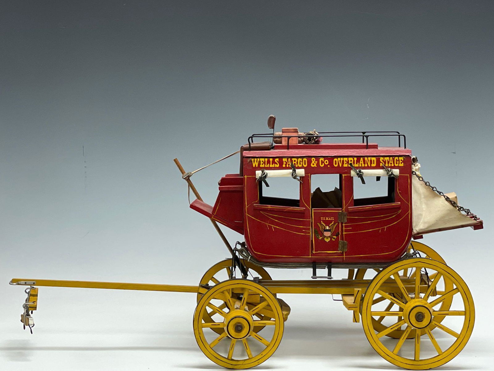 1970's Wells Fargo & Co Overland Stage Coach: 1970's Wells Fargo & Co Overland Stage Coach. Having original letters and purchase receipt from Globe and Anchor Militaria Shop New York for $500 dated Nov. 15th 1973. Measuring approx. 30.5" long