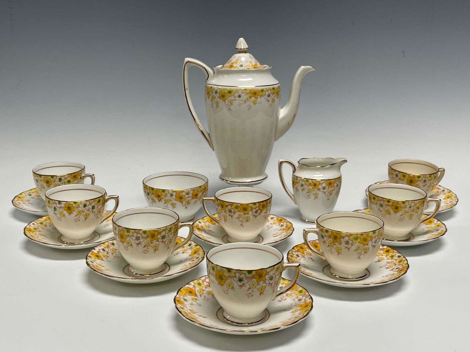 Rosina Bone China England Tea Set: Rosina Bone China Set Includes; tea pot, 8 saucers, 8 cups and cream and sugar. In good age appropriate condition, see photos.