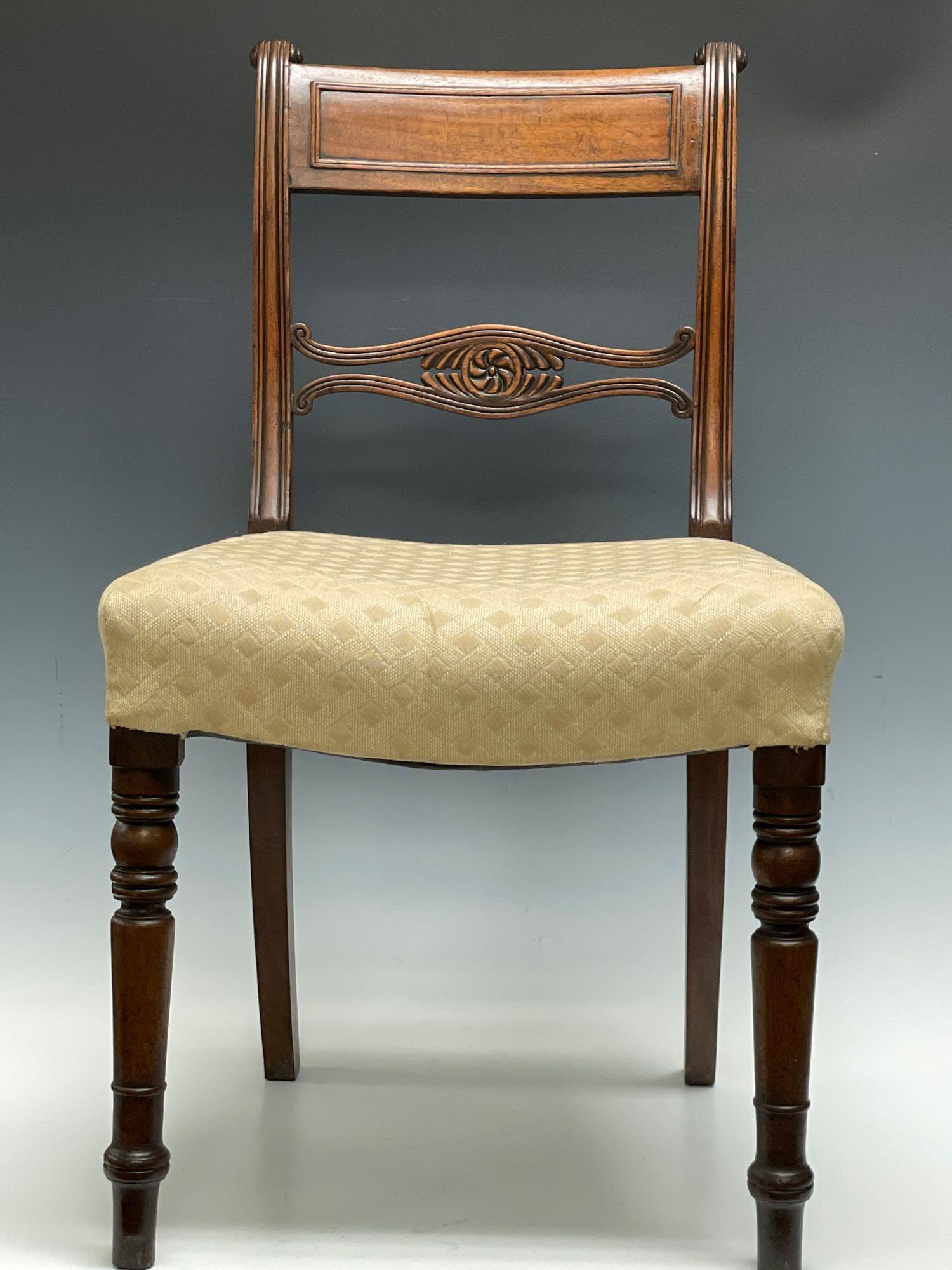 1810-1820 Carved Mahogany Duncan Phyfe Chair: American, New York, 1810-1820, possibly shop of Duncan Phyfe, carved slat back and scroll on molded saber legs. Measuring approx 33-1/2 in. (overall height), 18 in. (seat height). See photos for detai