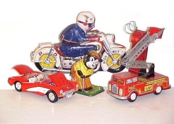 Collection of Four Japan Pressed Tin Litho Toys, : including friction motorcycle, bear golfer '' no ball if ever had one works perfect '', battery op. working fire engine and newer cast 1957 corvette car. All good condition, motor cycle has scratches 