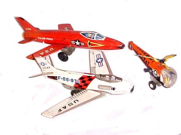Pressed Tin Toys Two Airplanes & Helicopter, : all friction toys. Red airplane by T M Japan. Action broke, minor scuff marks. White plane works with friction moving guns, wings need adjustment, dents and scratches. Helicopter works & good conditio