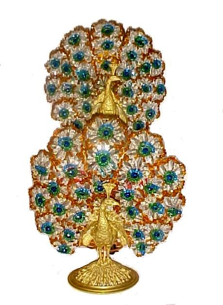 Fabulous Pair Austrian Bronze Peacock Lamps,: Signed Austria on base. Peacocks standing on oval foliage base both looking to the left. With wide tail feathers of Czechoslovakian glass beads in multiple colors. With 26 green rosettes each and larg