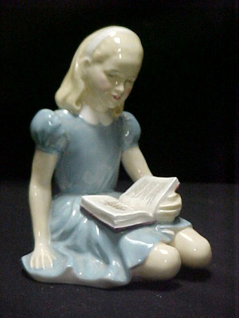 Royal Doulton Alice Ca. 1959 HN. # 2158: as the young girl sitting reading "The Walrus" the passage from Alice in Wonderland, painted in polychrome enamels, HN 2158. (4 7/8"H). Condition: excellent, no damage or repair.