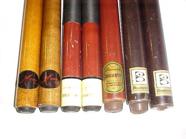 Collection Of Seven Vintage Pool Cue Sticks,: including Brunswick, Stealth and Mcue. Normal scuff and scratch marks, some tips missing over all good condition.