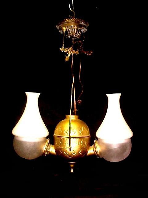 Doulbe Hanging Angle Lamp Marked N.Y. Co.: been converted to electric. Brass finish painted over to very light gold.