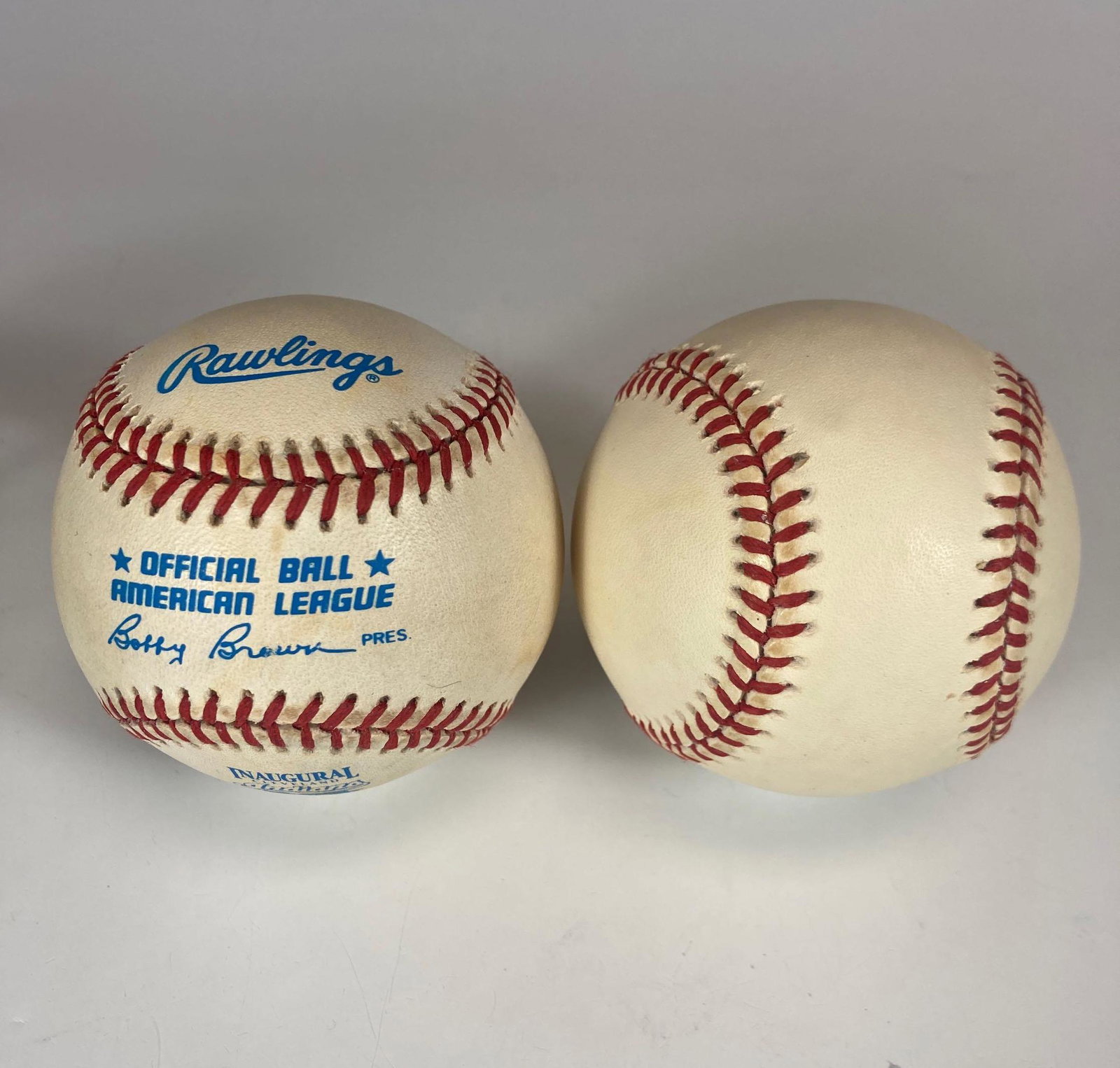 Pair of 1994 Inaugural Jacobs Field Baseballs Cleveland: Two official Bobby Brown baseballs with the 1994 inaugural logos. Toning throughout. Obtained from the residence of Bob and Anne Feller