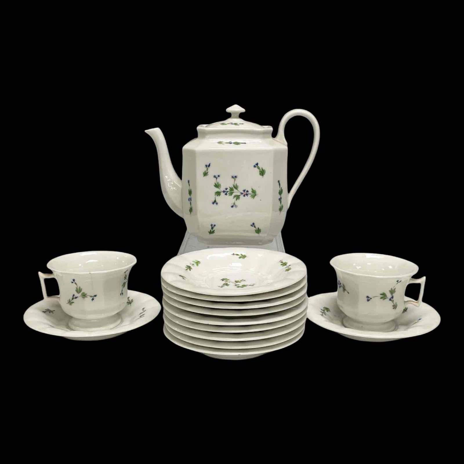 English Hand Painted Tea Service: Partial set includes tea pot (small spout chip) two cups 11 saucers. One hairline in cup as shown, see photos for details.