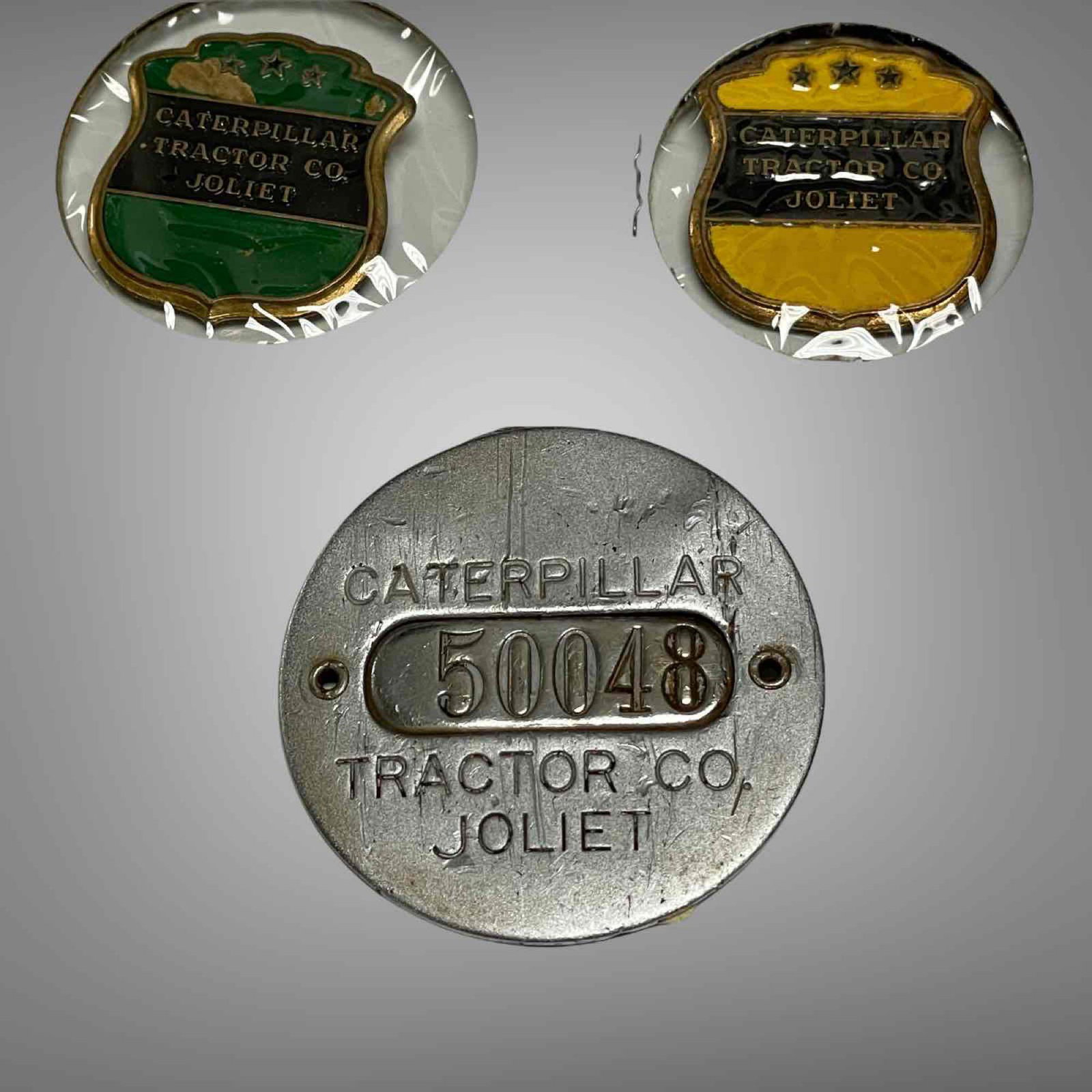 THREE CATERPILLAR TRACTOR PINS AND SERIAL NUMBER TAG (1 of 9)