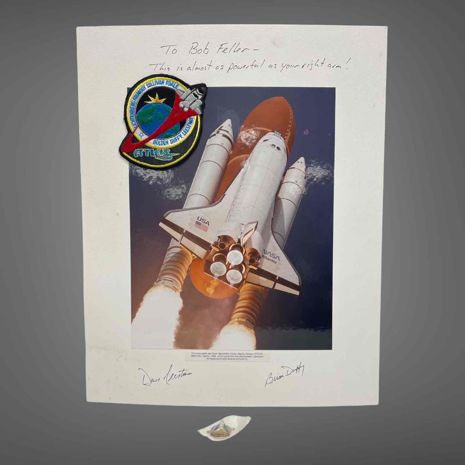 1992 ATLANTIS AUTOGRAPHS AND FLIGHT PATCH DISPLAY: 16x20 display waiting to be framed. Thick stock that has been signed by two of the astronauts from a March 1992 flight of Orbiter Atlantis; Brian Duffy and David Leestma. One of them personalized it a