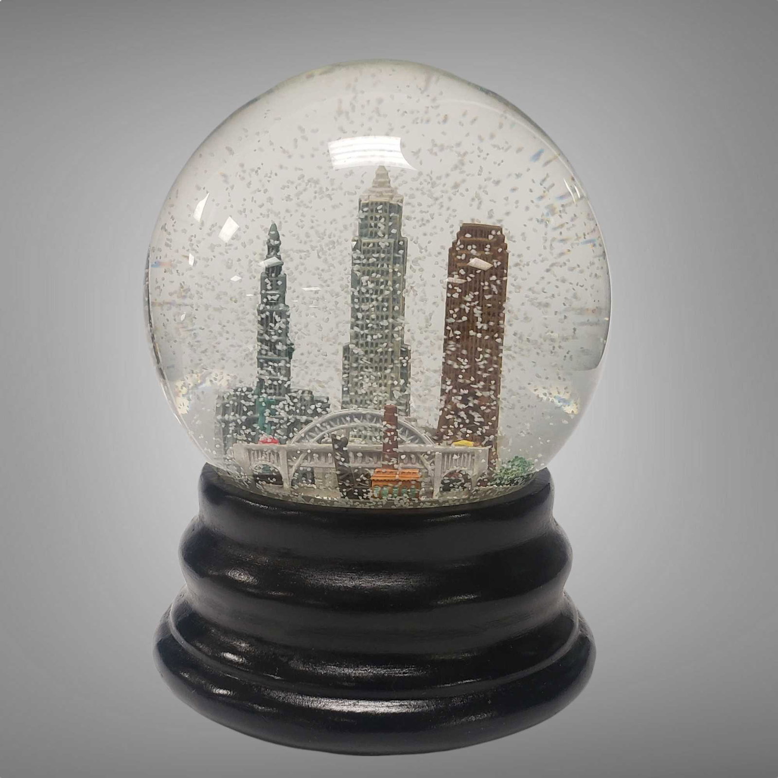 SAKS FIFTH AVENUE CLEVELAND OHIO SNOW GLOBE: We are not sure if Bob gave these as gifts or received them. Attractive snow globe with the original present gift packaging and box. Works great! Snow in Cleveland! Unopened, photos taken of one the f