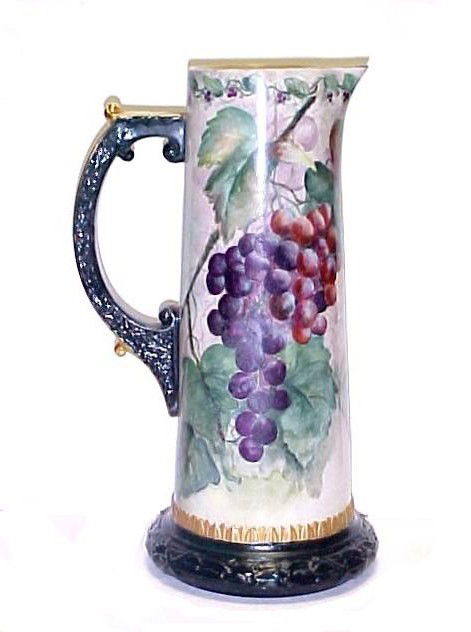 Belleek Vintage Grape Pattern Tall Pitcher,: with embossed handle and base. Condition not 100 % positive base rim may have been repainted or repaired, if so excellent job. 14'' tall. Always willing to discuss commission rate's on higher quality