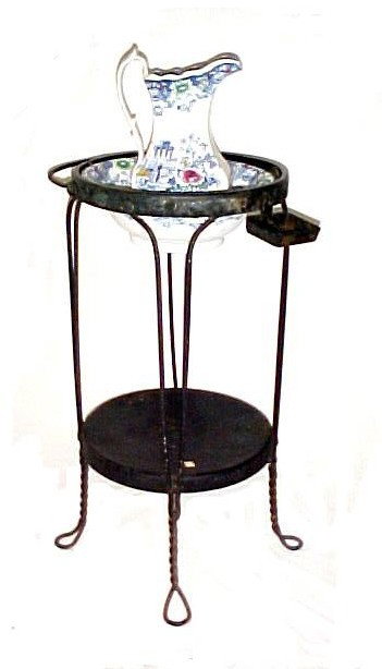Cleopatra Pattern Ironstone Pitcher And Bowl,: with believed to be original twisted wire metal washstand. In overall good condition minor wear to bowl from age. Looks great though no chips.