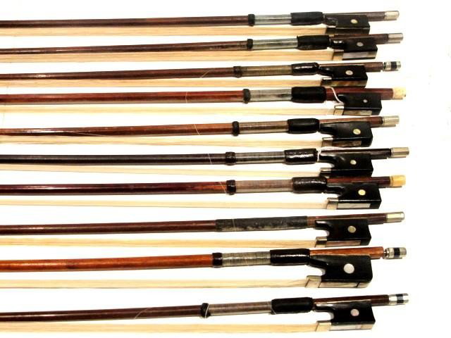 Collection Of Ten Student Violin Bows Of Various : ages, markers and condition..
