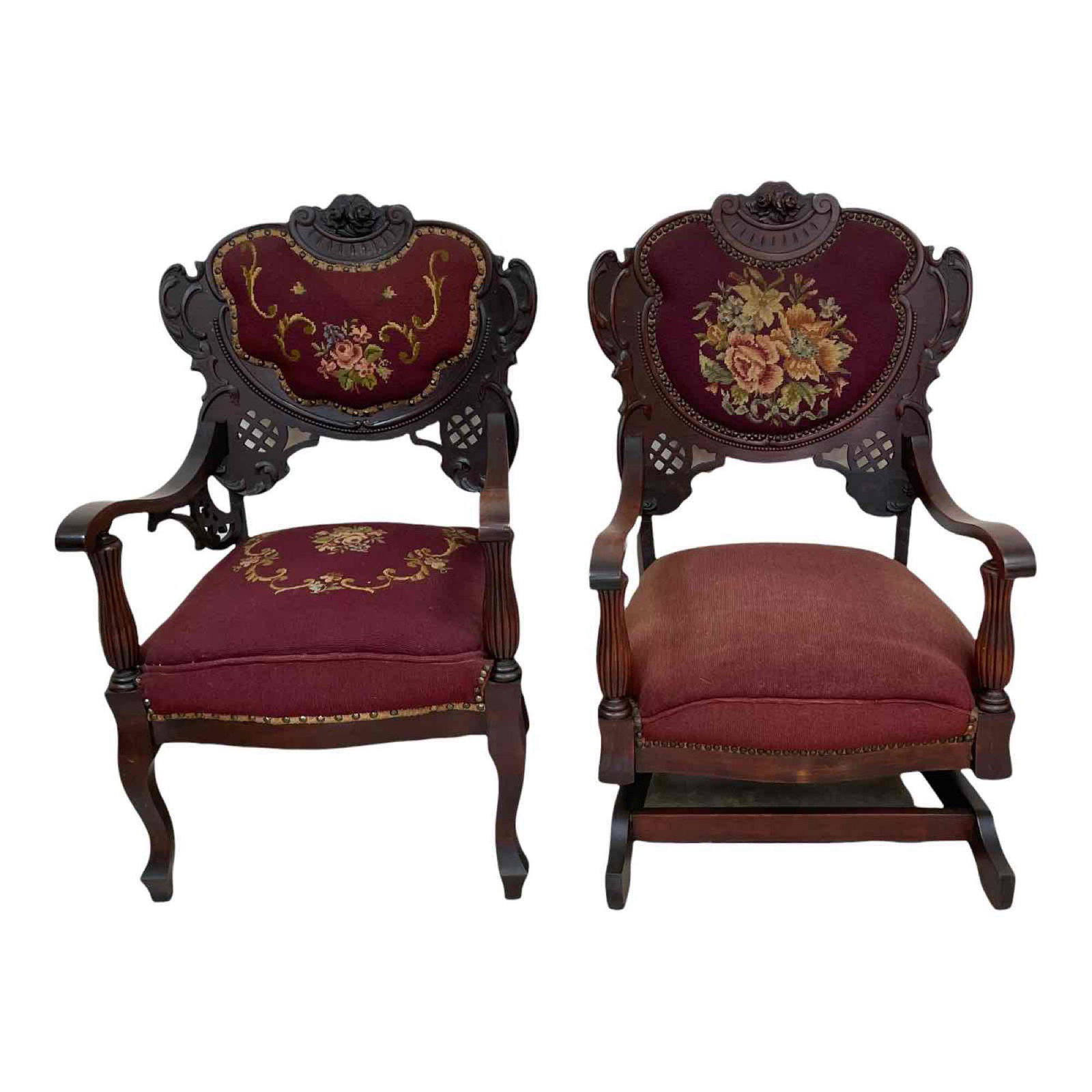 Pair of Victorian His and Her Chairs: A pair of Late Victorian "His and Hers" chairs of comfortable proportions, comprising an armchair and a rocking chair with carved rococo style decoration and needlepoint seats. Approximate dimensions: