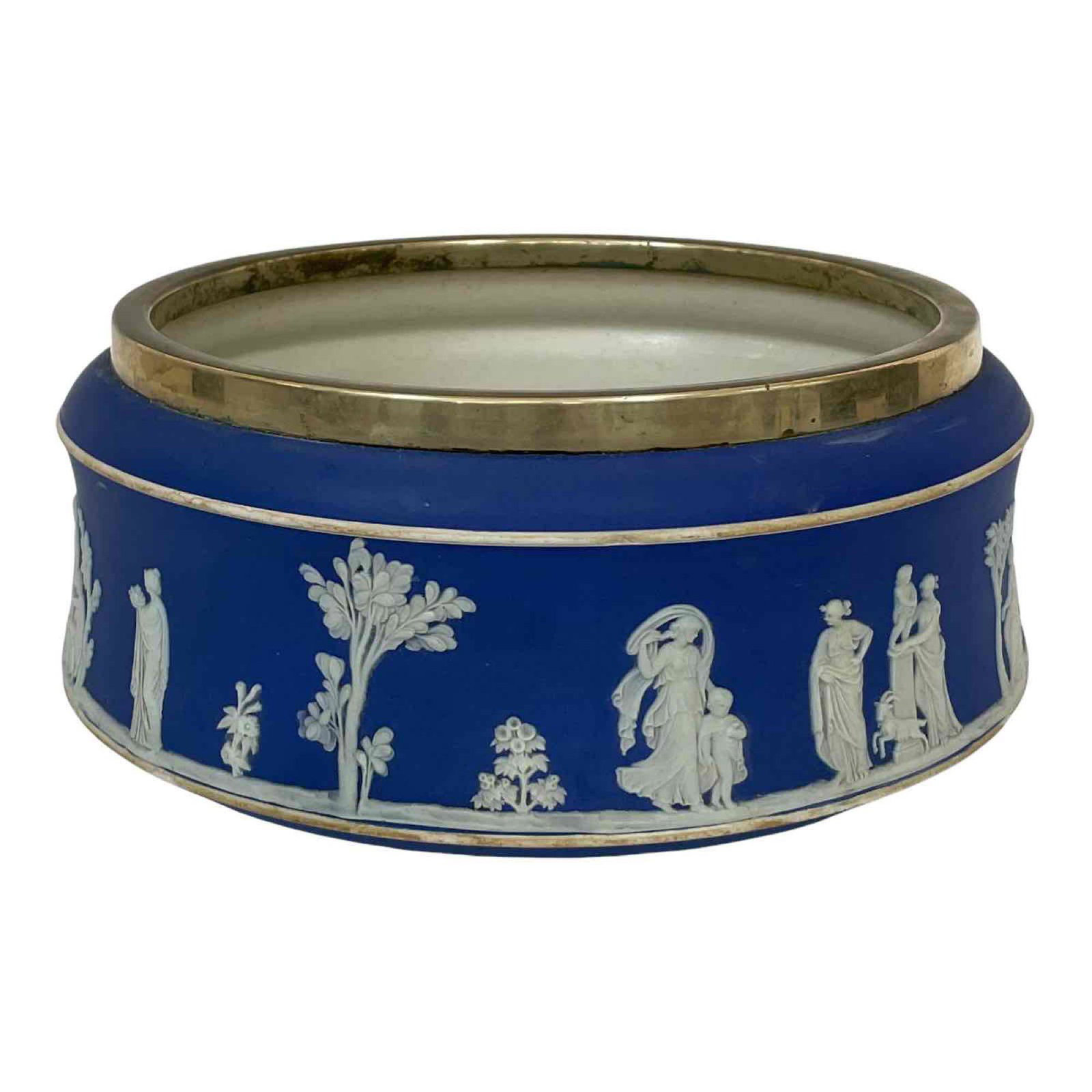 Early Wedgwood Centerpiece Console Bowl: English Wedgwood dark blue Jasperware salad or center console bowl with silver plate rim. Circa before 189o. Measuring approx 10" diameter. Normal use and wear consistent with age, see photos.